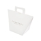 कस्टम लोगो व्हाइट क्राफ्ट वर्तमान पेपर बैग 9.5 * 9 * 12 सेमी फ्रेंच उपहार बैग रिबन के साथ